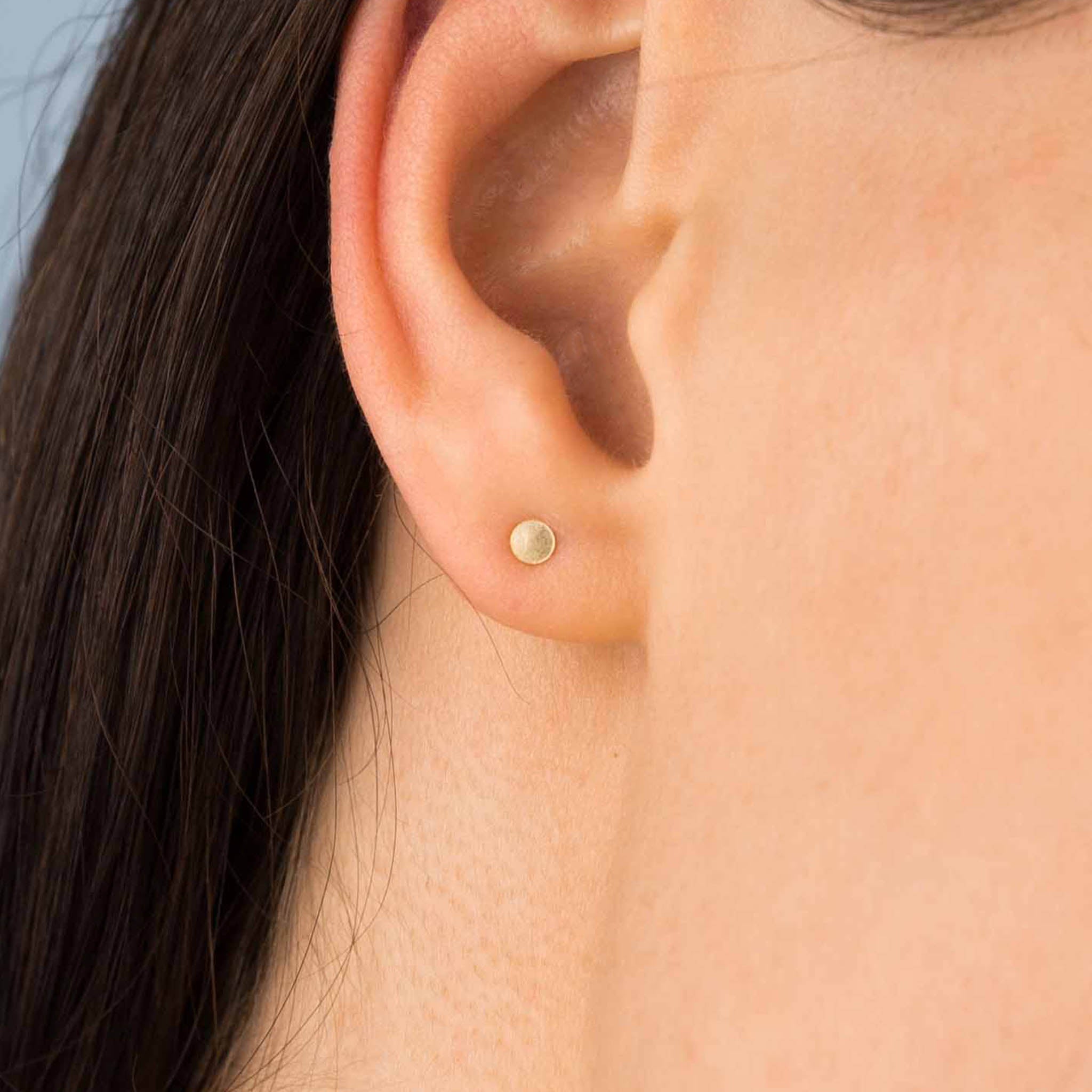 Gold circle stud earrings